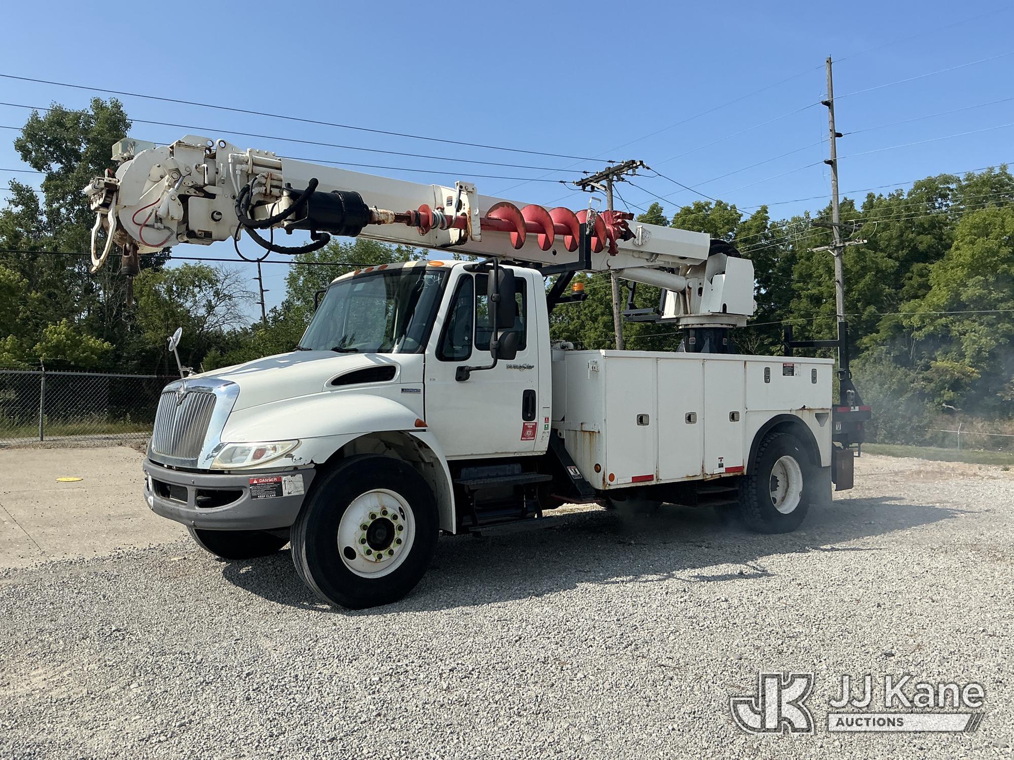 Altec DM47 BR, Digger Derrick rear mounted on 2009 International 4300 Utility Truck