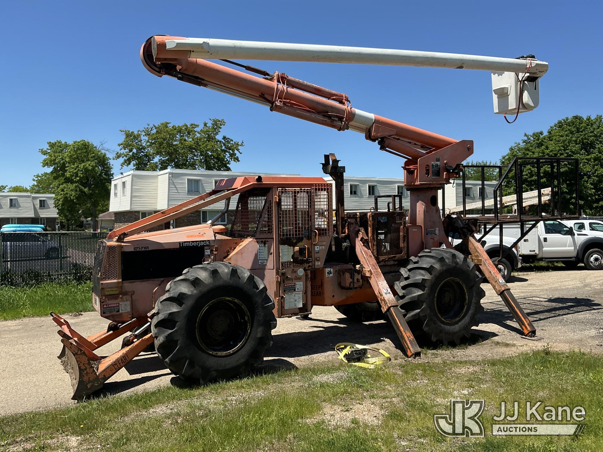 Altec LRIII52, Over-Center Bucket Truck mounted on 1995 Timberjack 240 Rubber Tired Skidder