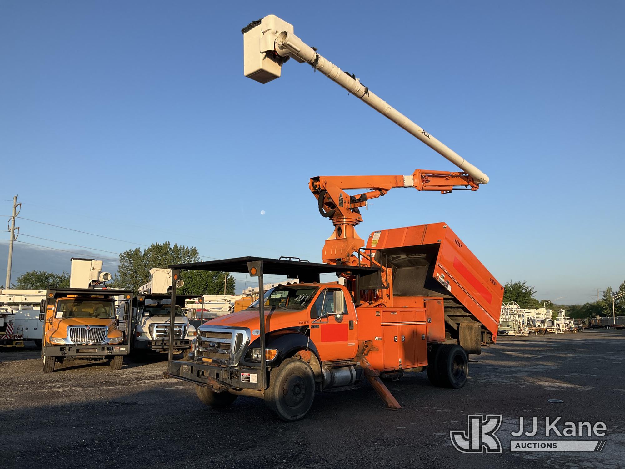 Altec LR760E70, Over-Center Elevator Bucket Truck mounted behind cab on 2013 Ford F750 Chipper Dump Truck