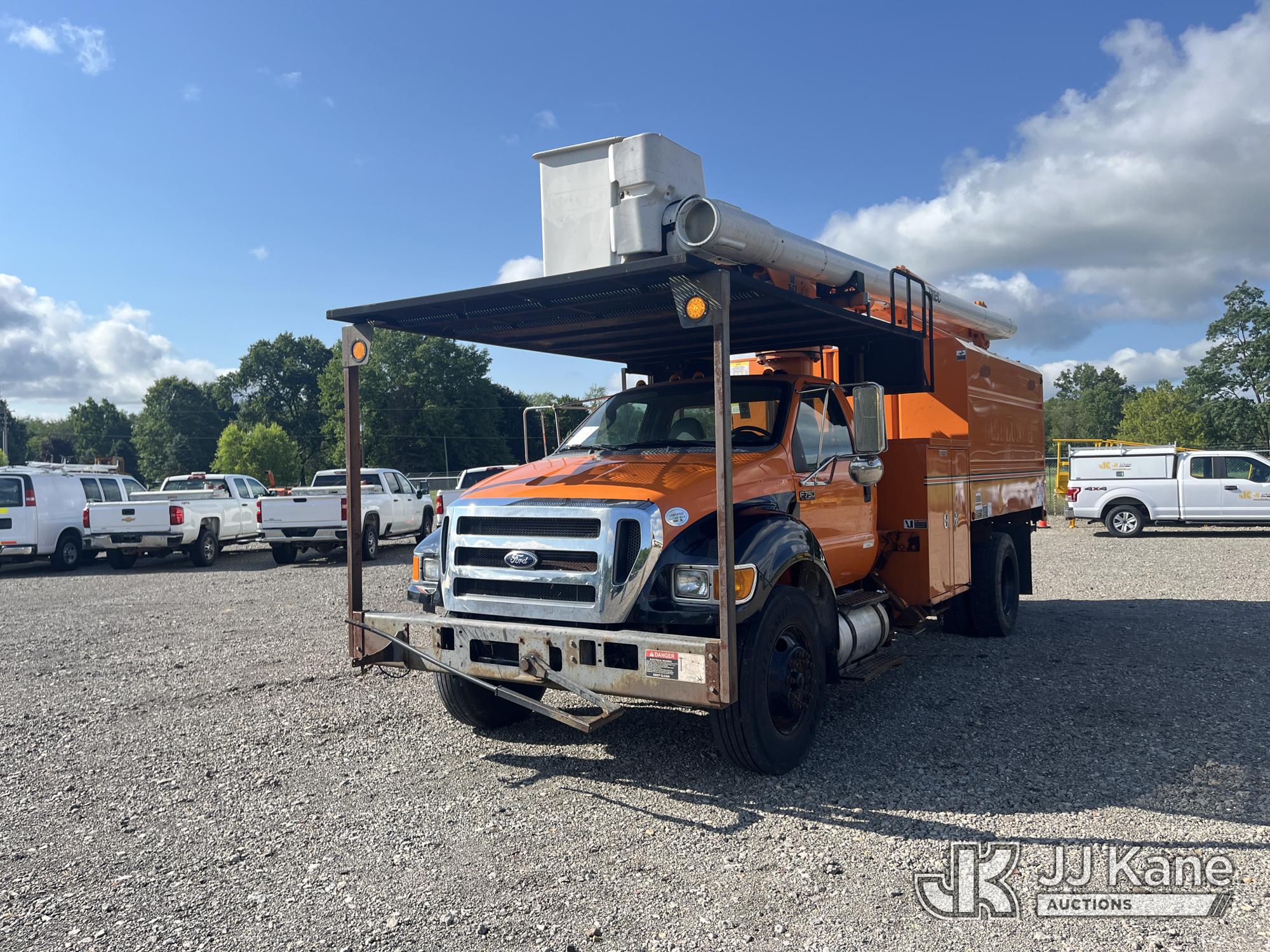 Altec LR756, Over-Center Bucket Truck mounted behind cab on 2015 Ford F-750 Chipper Dump Truck