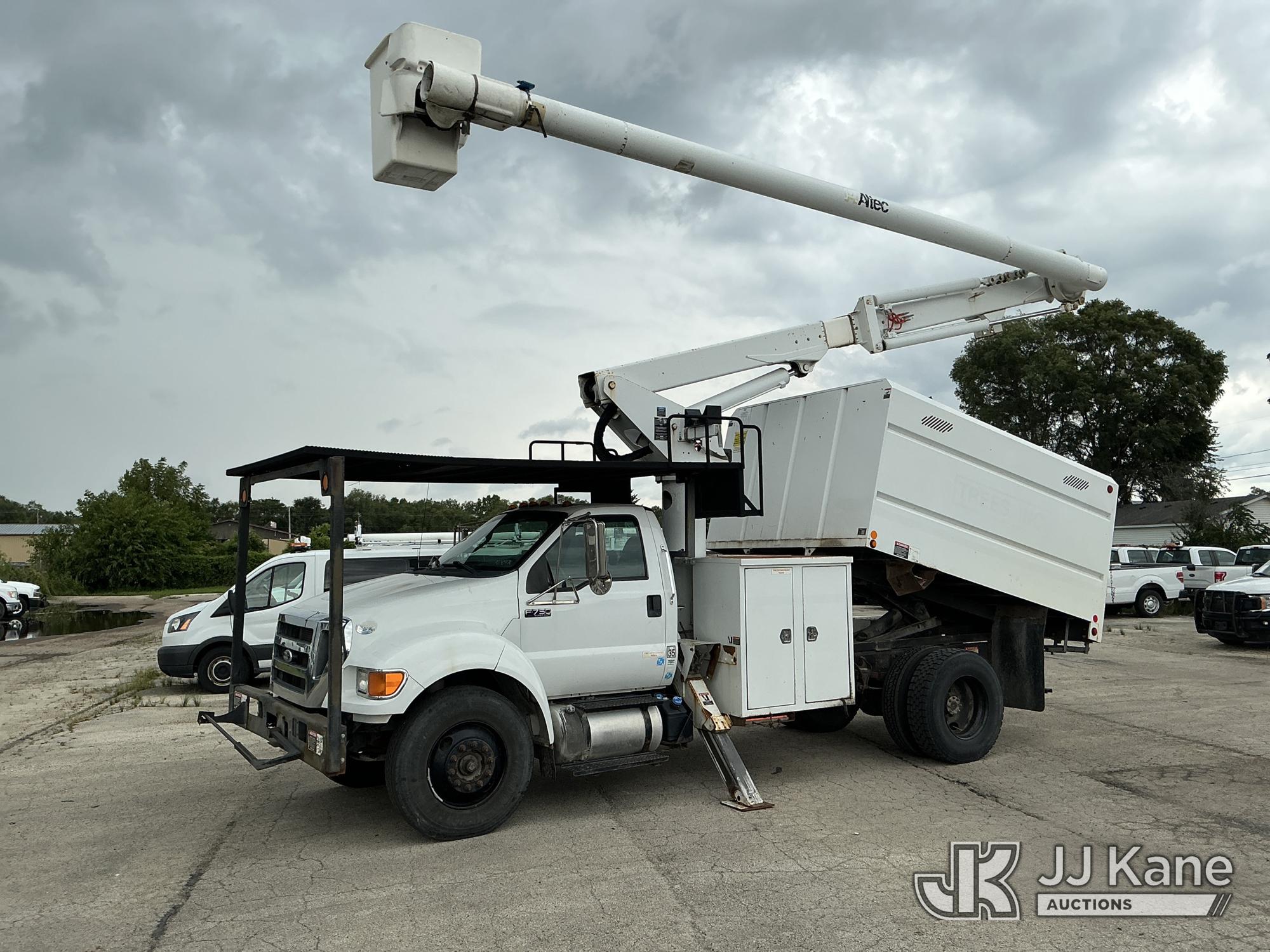 Altec LR756, Over-Center Bucket Truck mounted behind cab on 2013 Ford F-750 Chipper Dump Truck