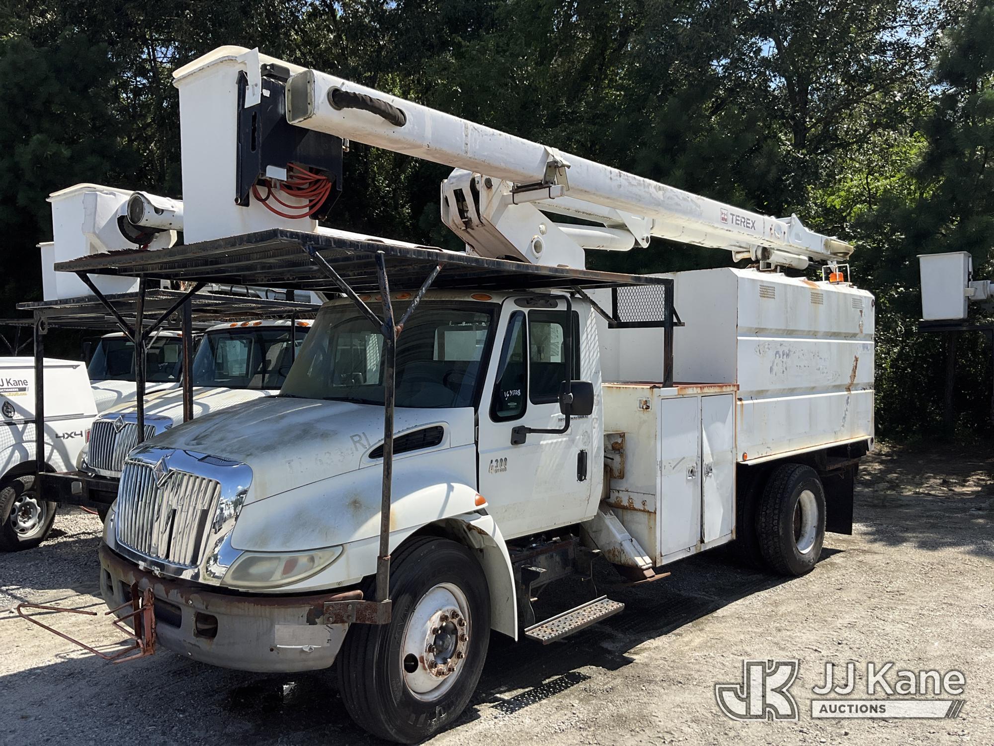 HiRanger XT5, Over-Center Bucket Truck mounted behind cab on 2006 International 4300 Chipper Dump Truck