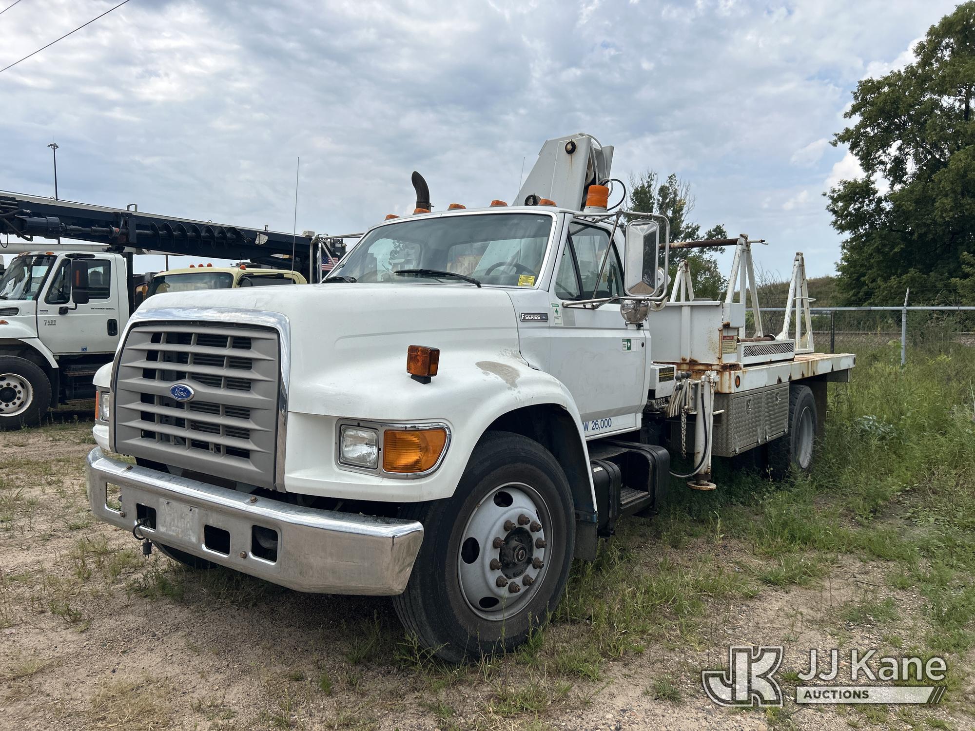 IMT 723, Knuckleboom Crane mounted behind cab on 1996 Ford F800 Flatbed Truck