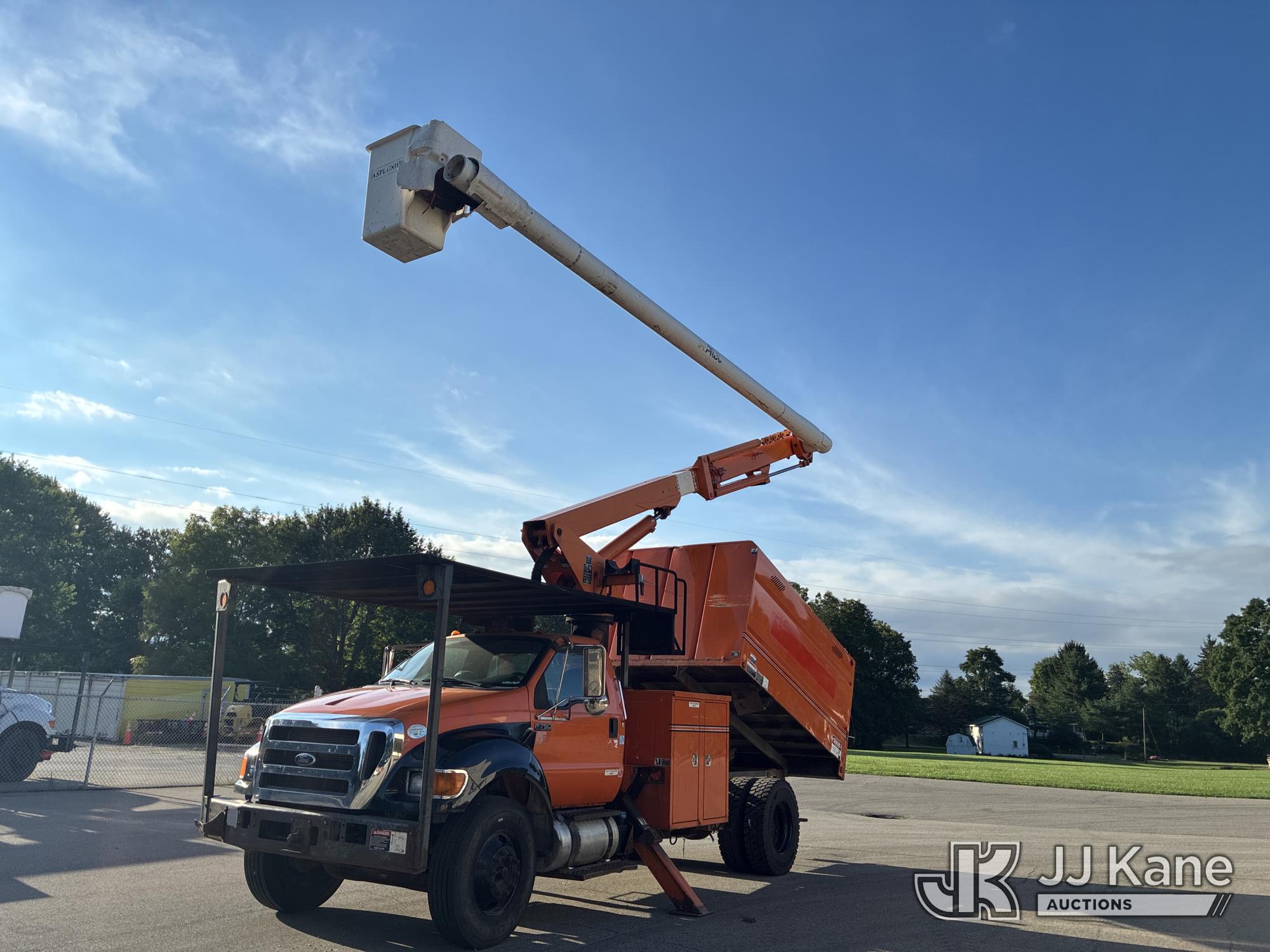 Altec LR756, Over-Center Bucket Truck mounted behind cab on 2015 Ford F-750 Regular Cab DRW Chipper Dump Truck